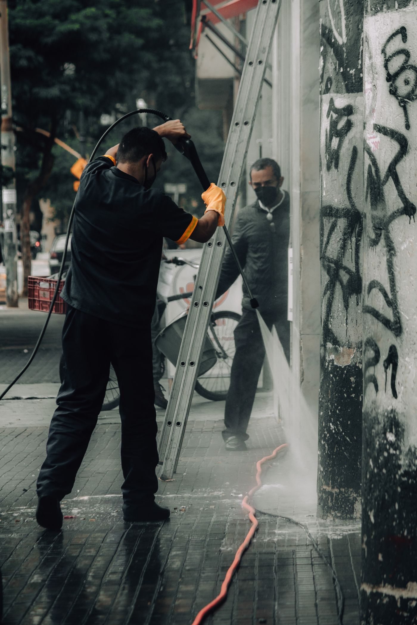 Commercial pressure washing of a storefront and sidewalk